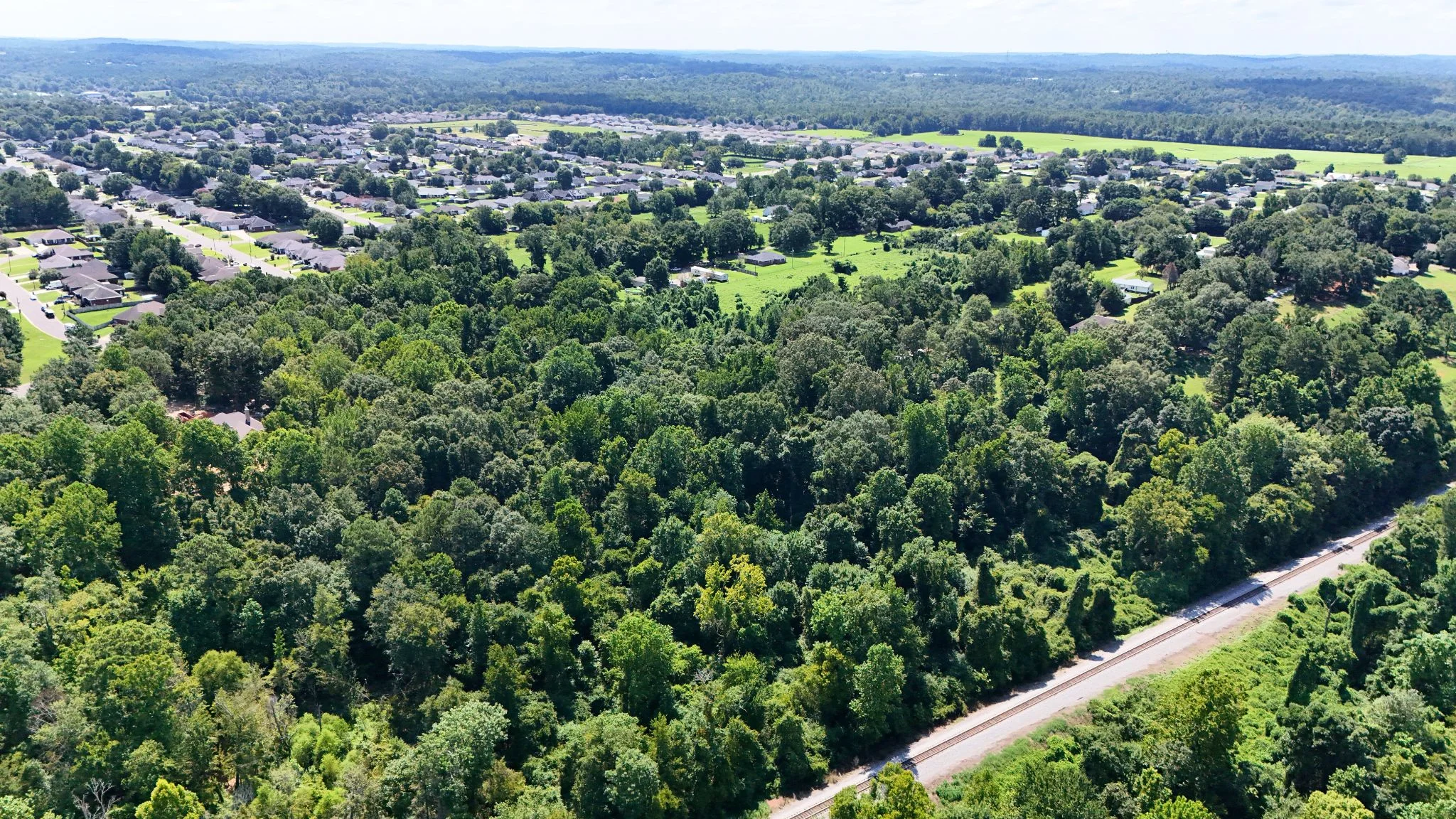 4.40 Wooded Acres Set in Tuscaloosa, Alabama with Creek, Utilities, & Safe Family Cul-de-Sac Living