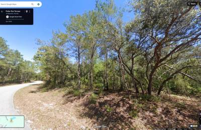 Set Back yet well-connected ¼ ac Lot close to the Ocklawaha River