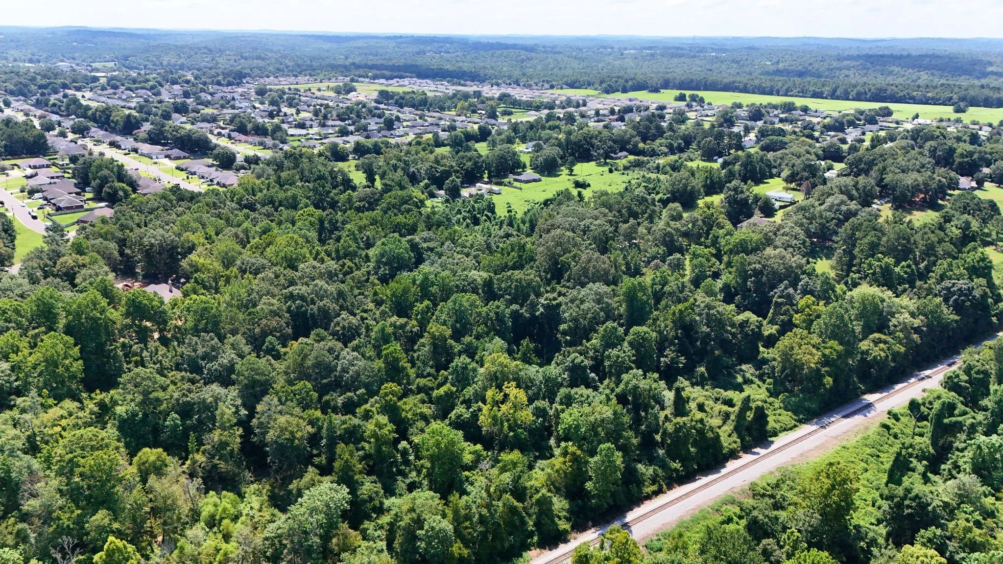 4.40 Wooded Acres Set in Tuscaloosa, Alabama with Creek, Utilities, & Safe Family Cul-de-Sac Living in Tuscaloosa County, AL