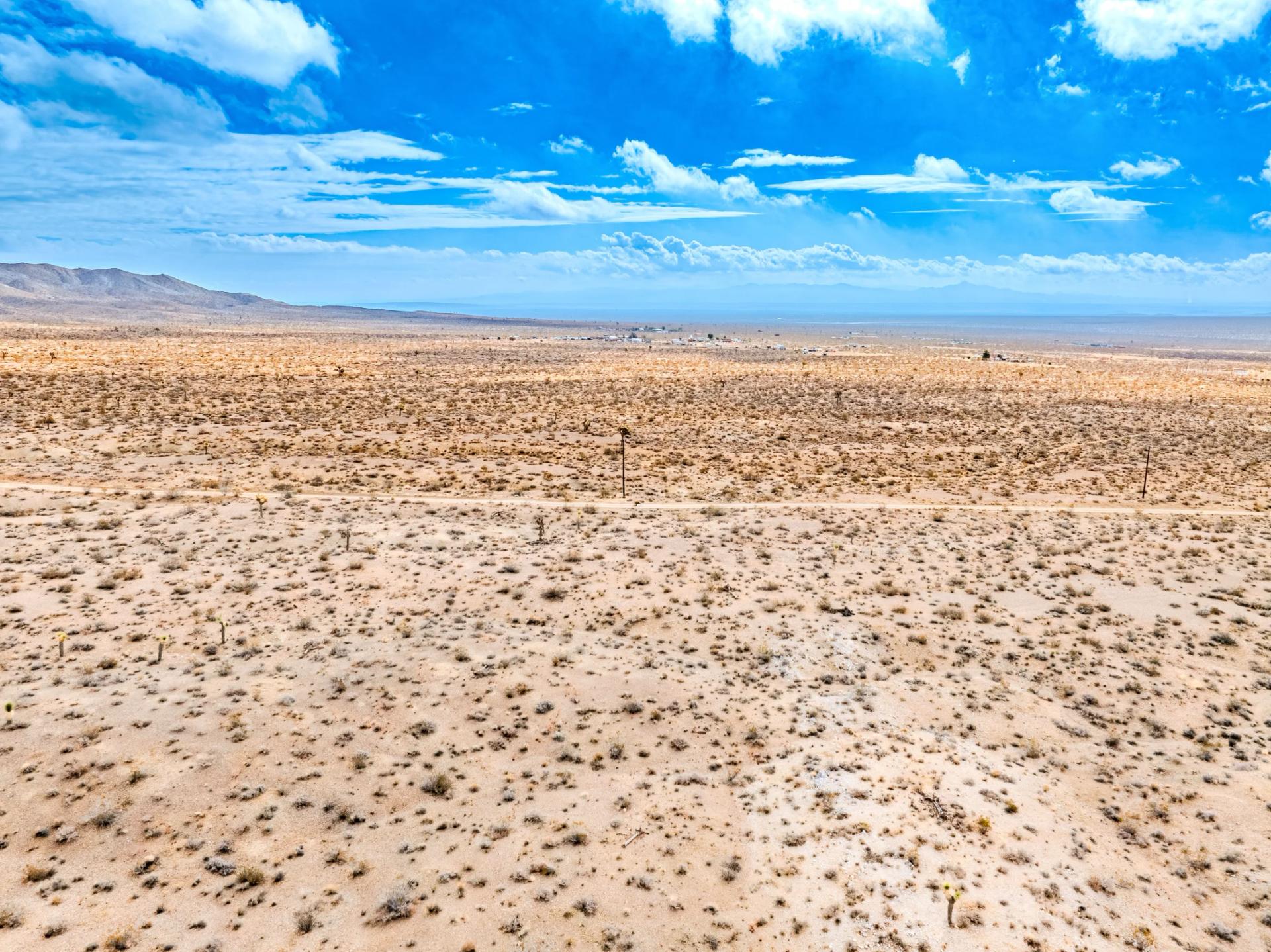 Decorative background for Panoramic Mountain Views + Power — 4.76 Acres in Adelanto, CA image 5