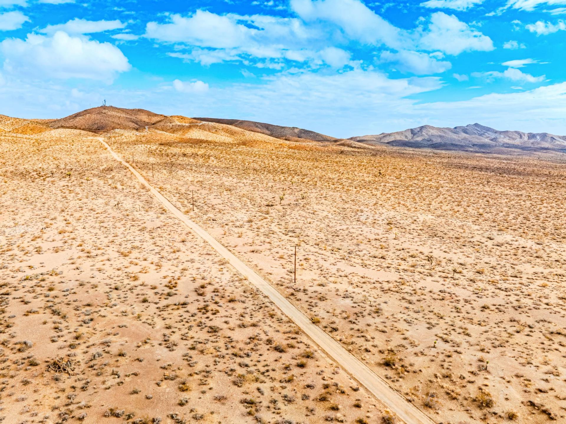 Decorative background for Panoramic Mountain Views + Power — 4.76 Acres in Adelanto, CA image 7
