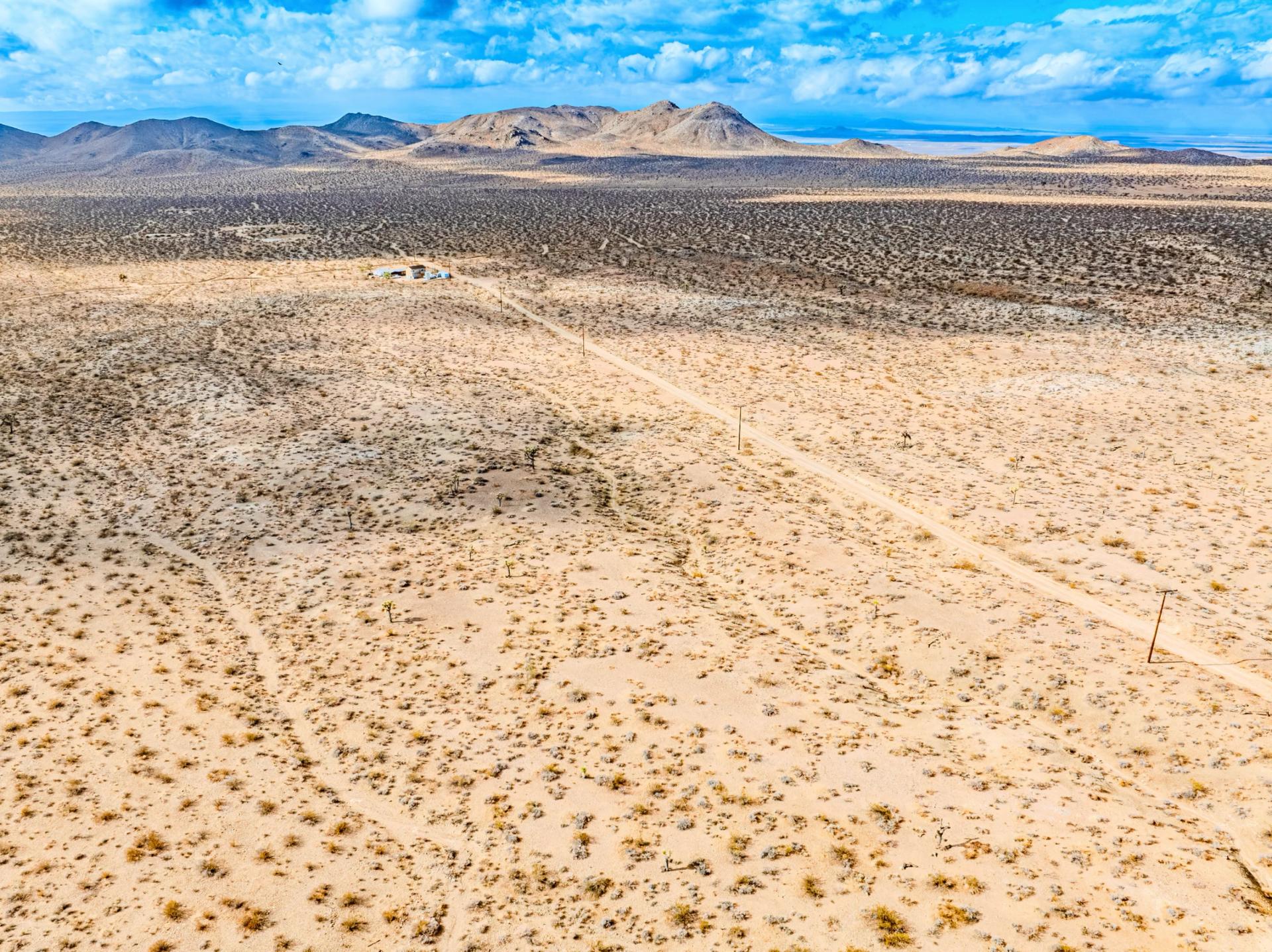 Decorative background for Panoramic Mountain Views + Power — 4.76 Acres in Adelanto, CA image 9