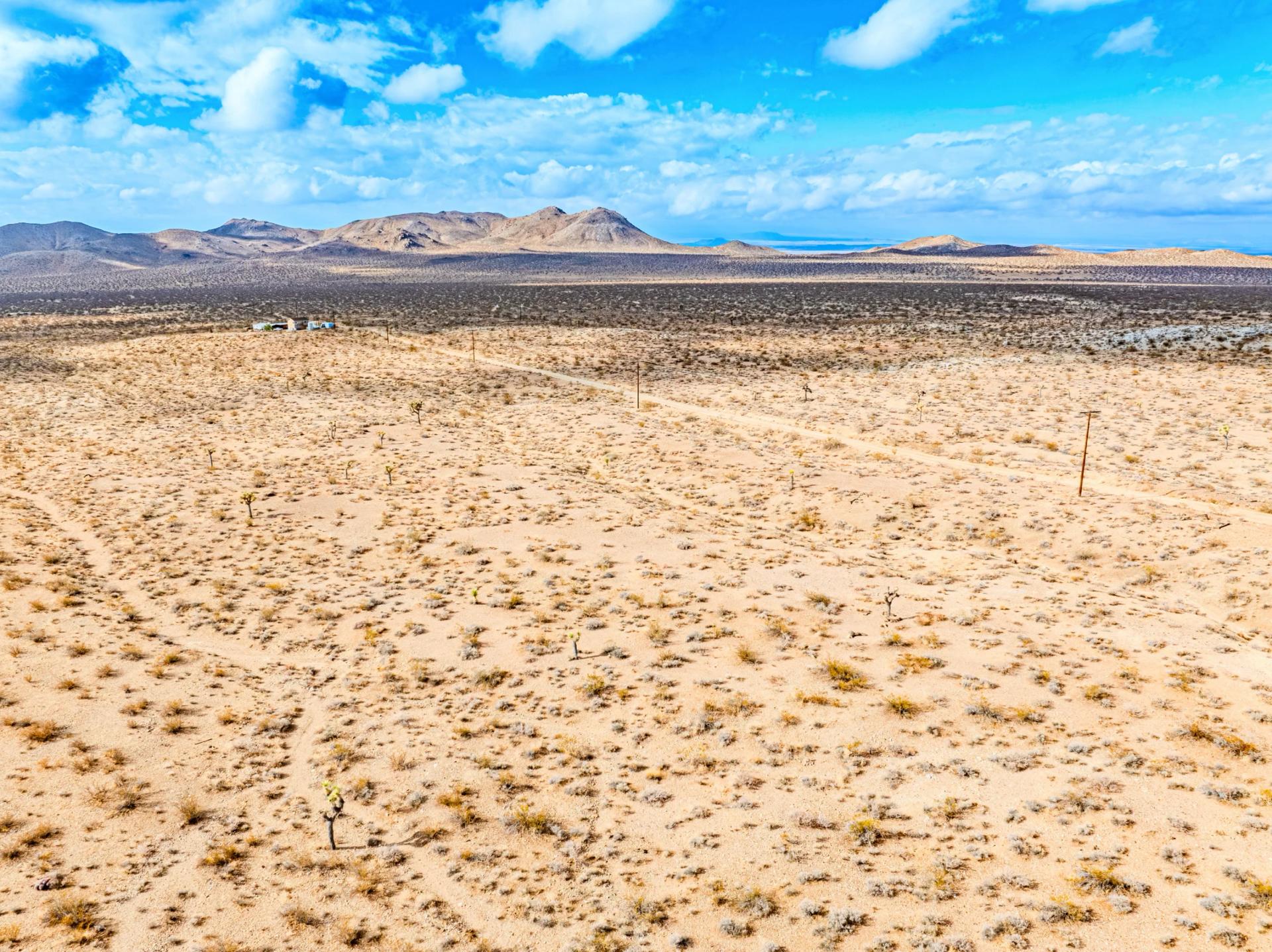 Decorative background for Panoramic Mountain Views + Power — 4.76 Acres in Adelanto, CA image 10