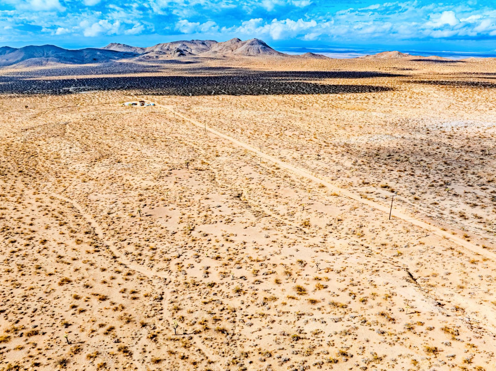 Decorative background for Panoramic Mountain Views + Power — 4.76 Acres in Adelanto, CA image 11
