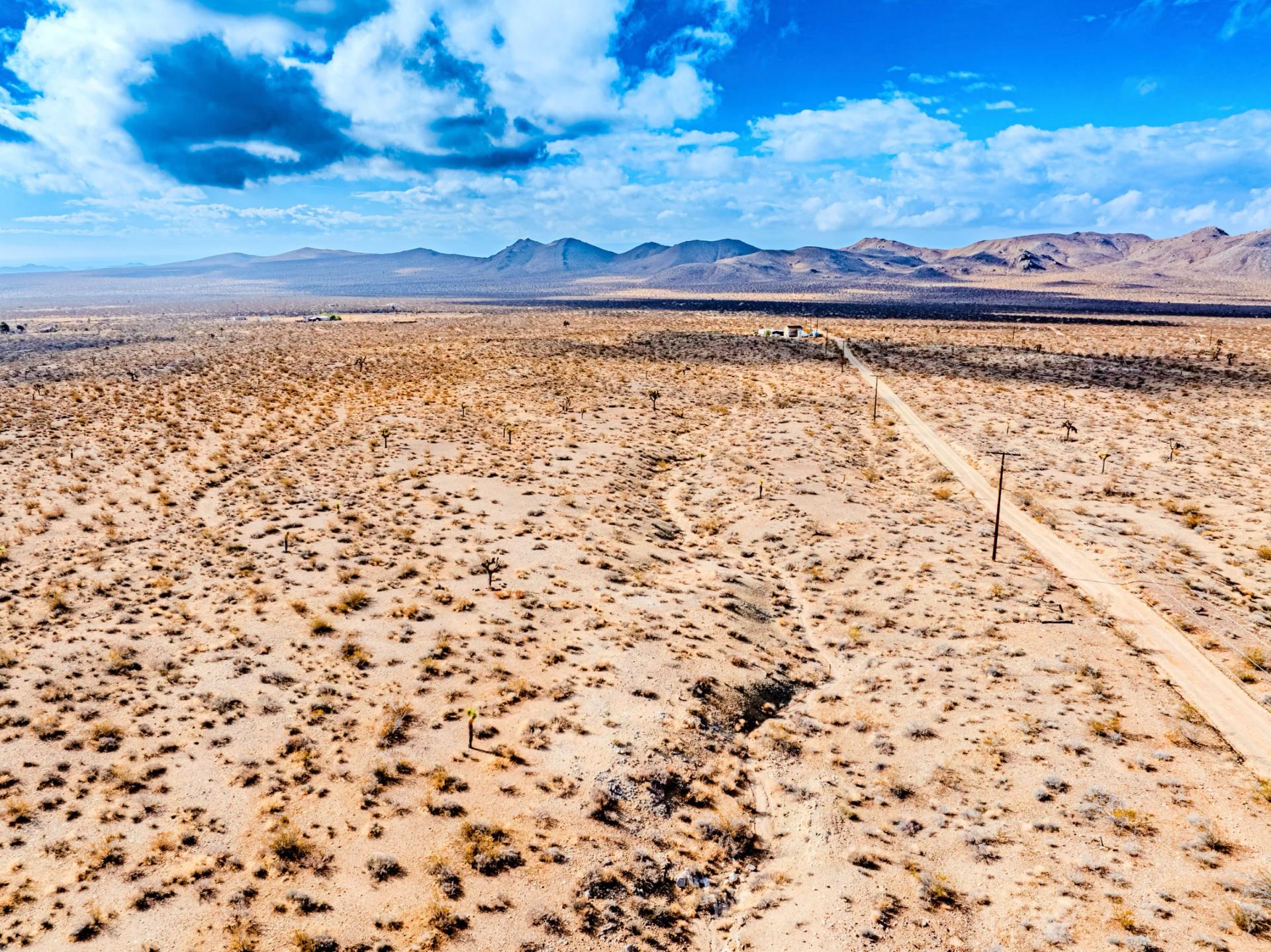 Decorative background for Panoramic Mountain Views + Power — 4.76 Acres in Adelanto, CA image 6