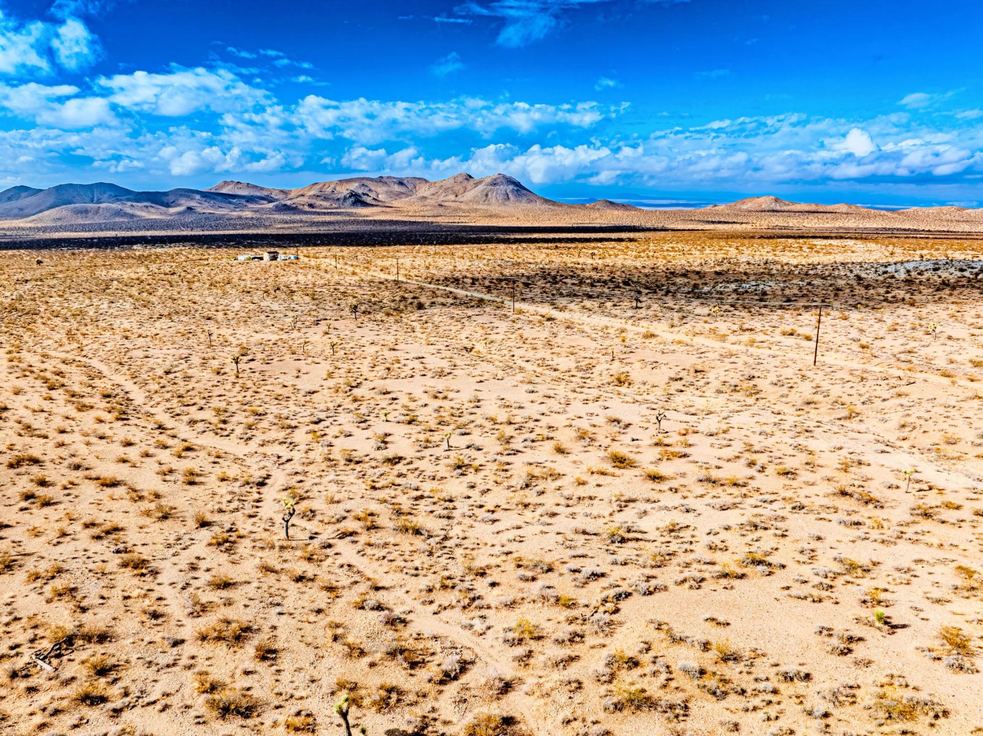 Decorative background for Panoramic Mountain Views + Power — 4.76 Acres in Adelanto, CA image 12